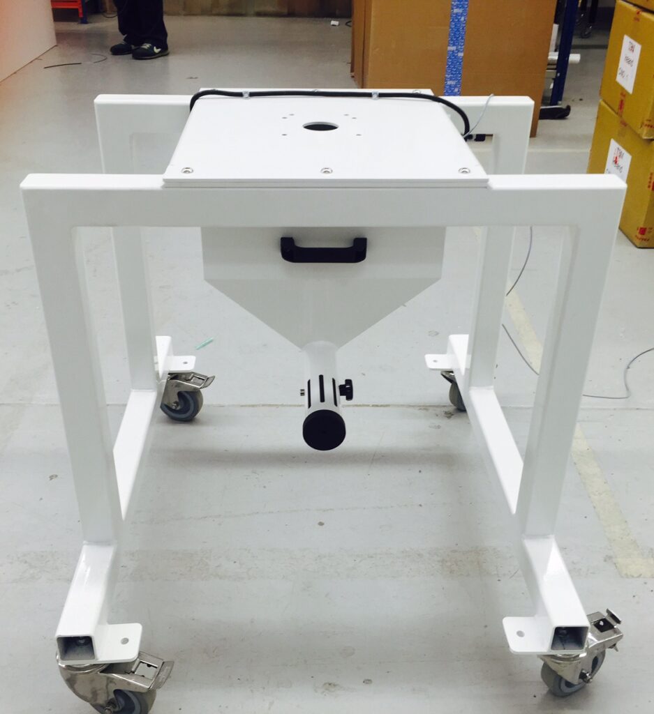 Front view of the TSM Blender Offline Stand, featuring a sturdy white frame, caster wheels, and a central funnel for material collection.